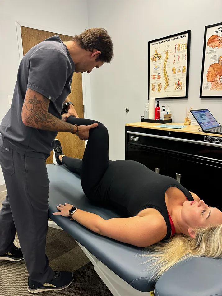 Chiropractor Rock Hill SC Clay Gasparovich Adjusting Pregnant Patient